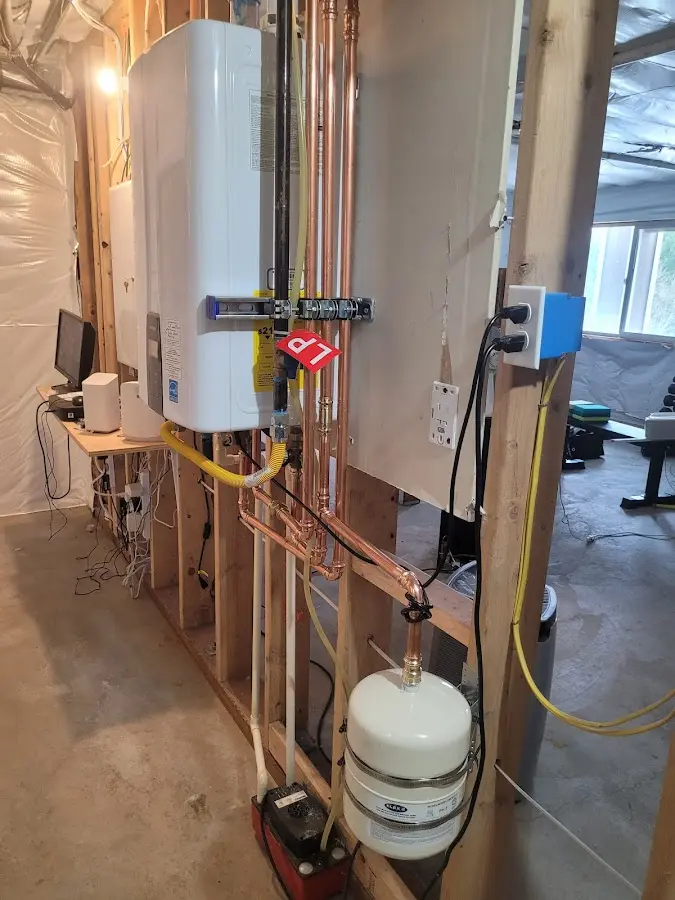 Licensed plumber repairing a kitchen sink in Teaneck